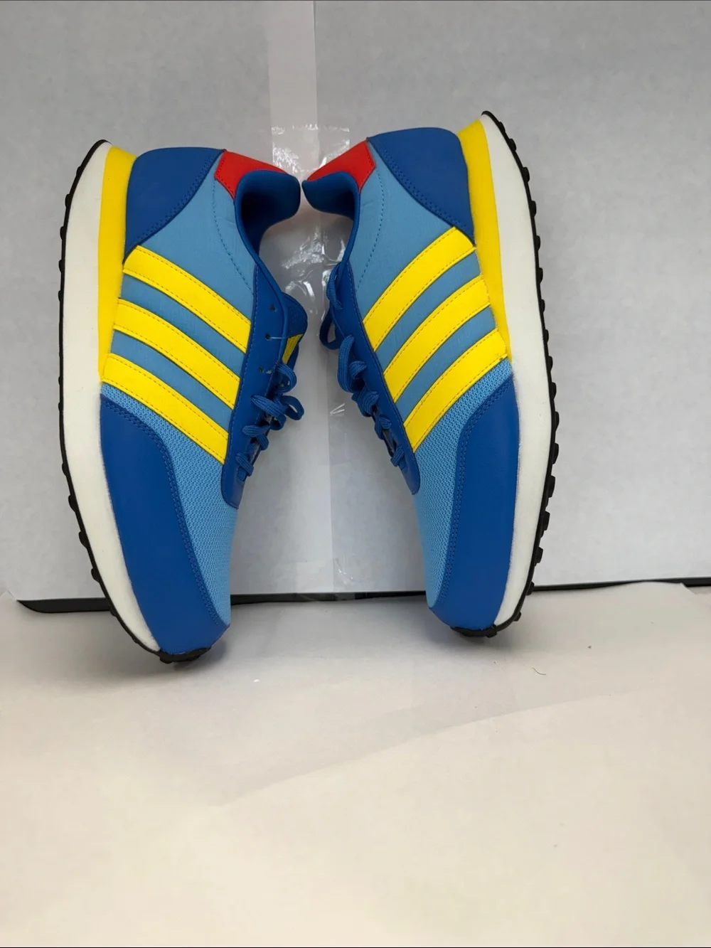 adidas Men's Blue Sneakers with Yellow Stripes and Red Heel Accent